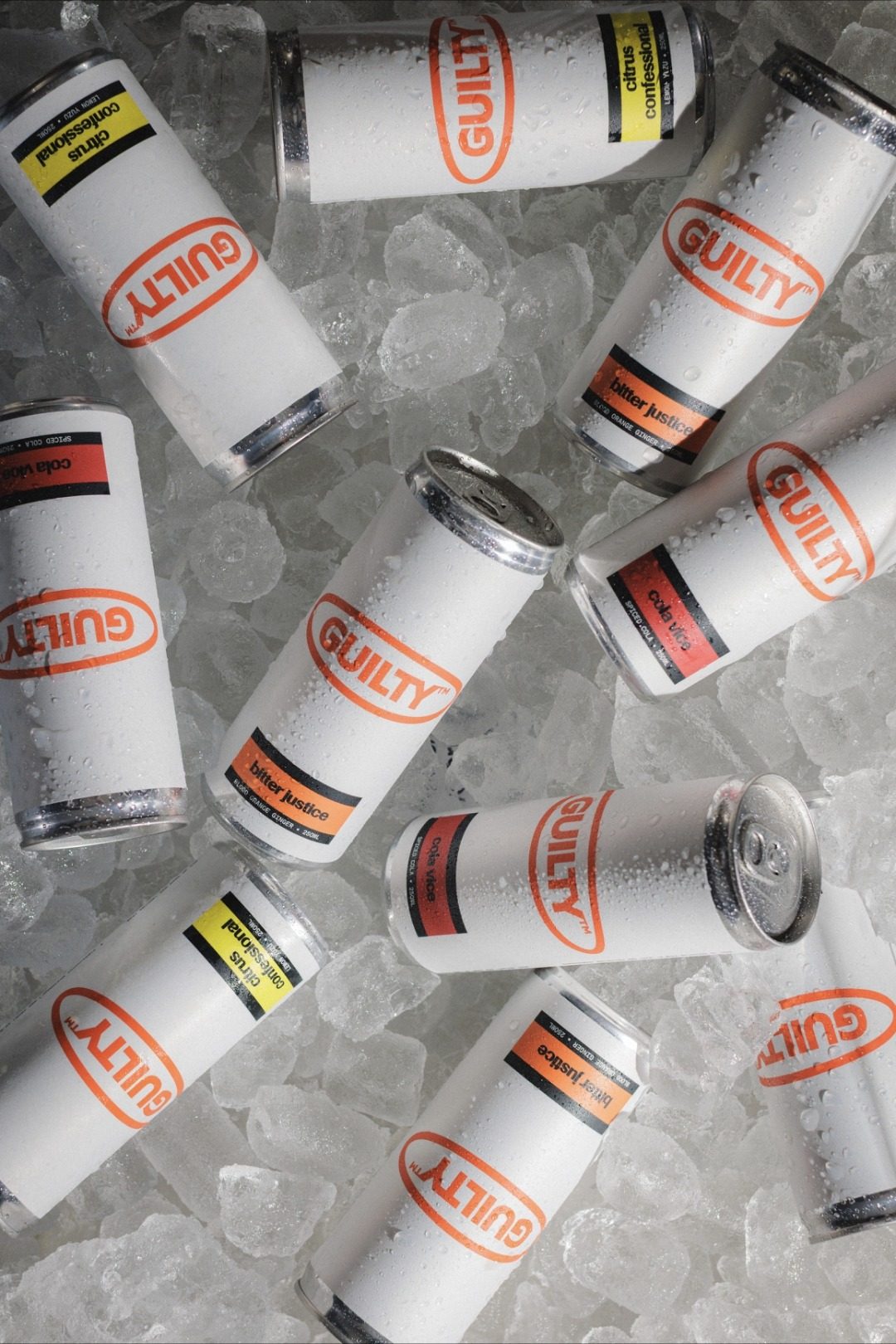 Guilty cans of all three flavours scattered on ice