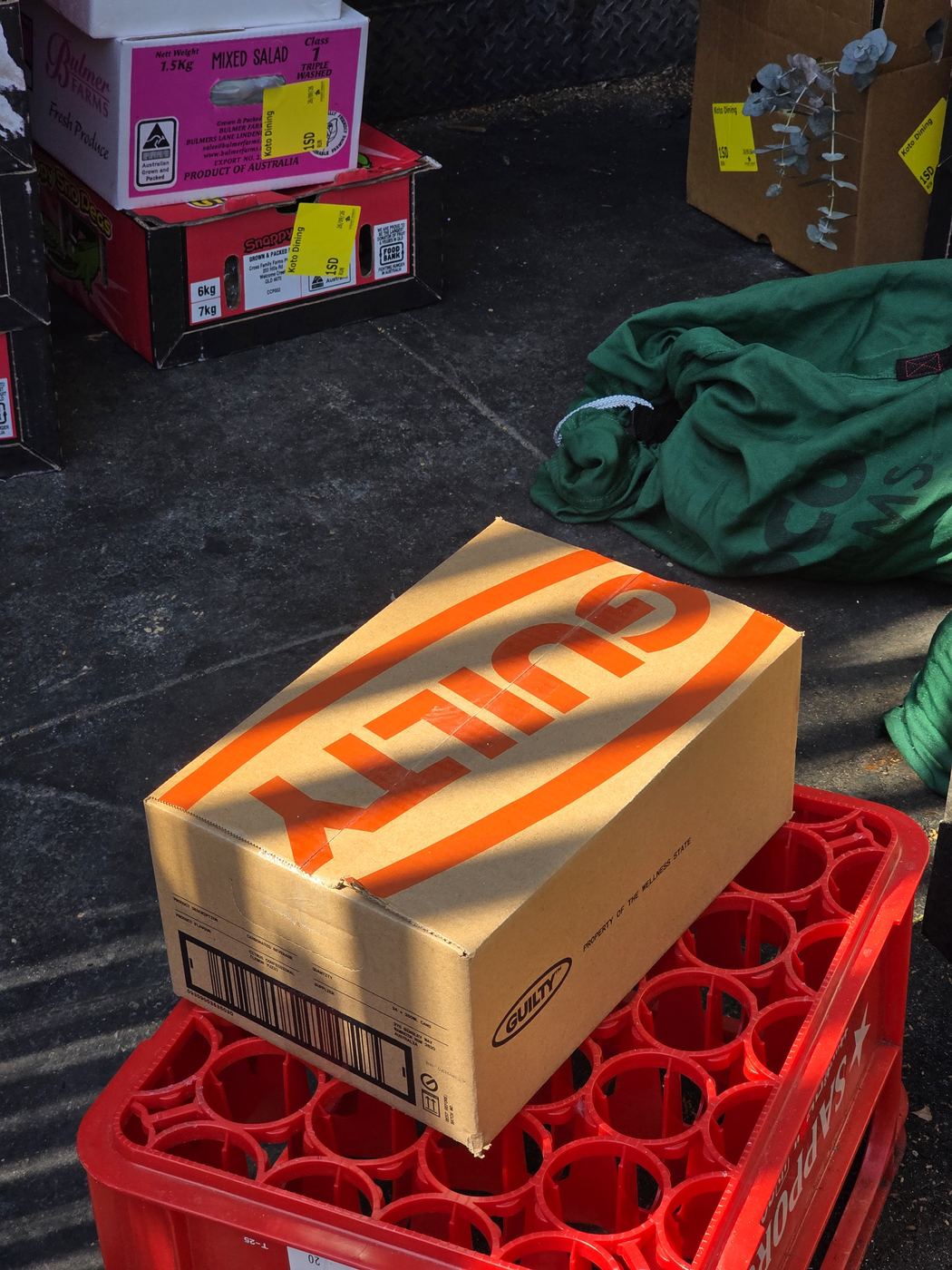 A Guilty shipping box on a red crate